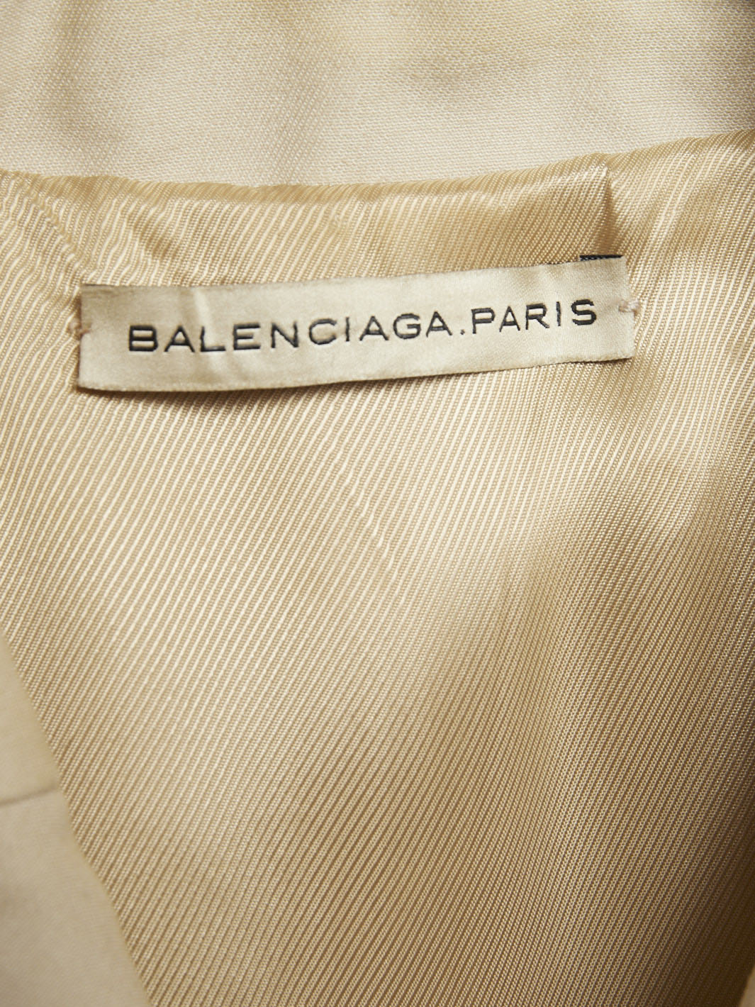 Y2K Balenciaga trench coat in beige with contrasting stitching.